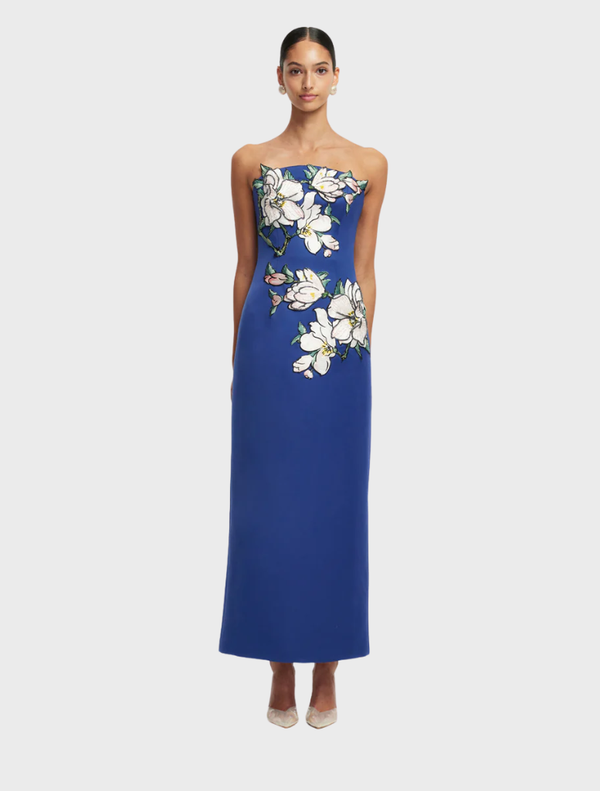 Midnight floral bustier maxi dress featuring intricate appliqué details and a flowing silhouette.
