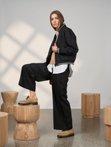 Black Trax reversible jacket displayed, showcasing its sleek design and versatile style for various occasions.