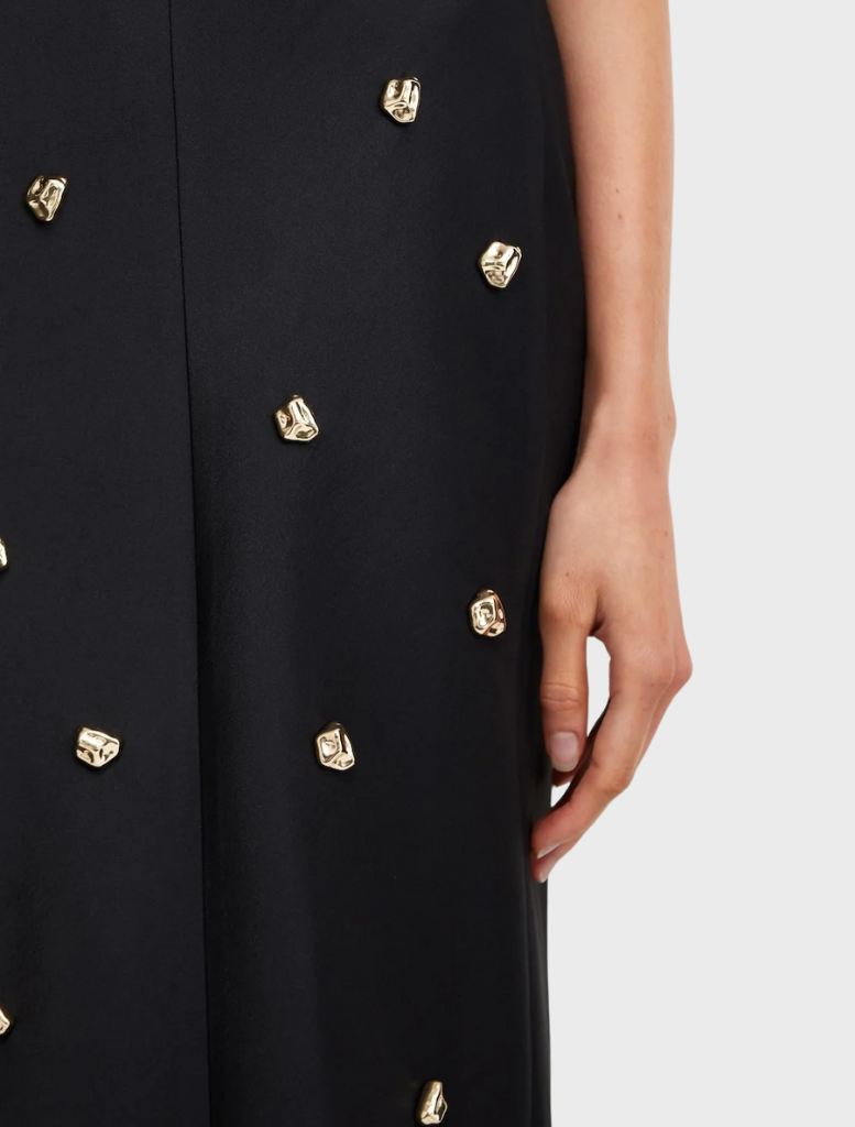 A sophisticated black evening gown embellished with shimmering gold stars, ideal for special events.