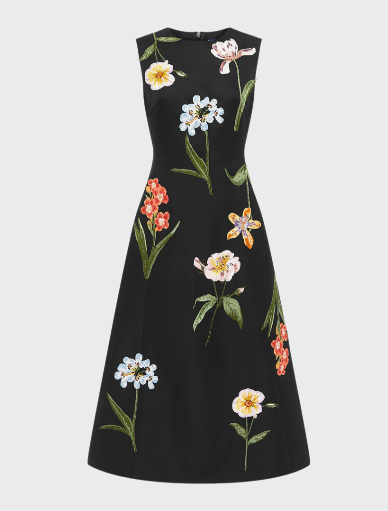 A black dress adorned with a floral pattern, featuring colorful flowers throughout its design.