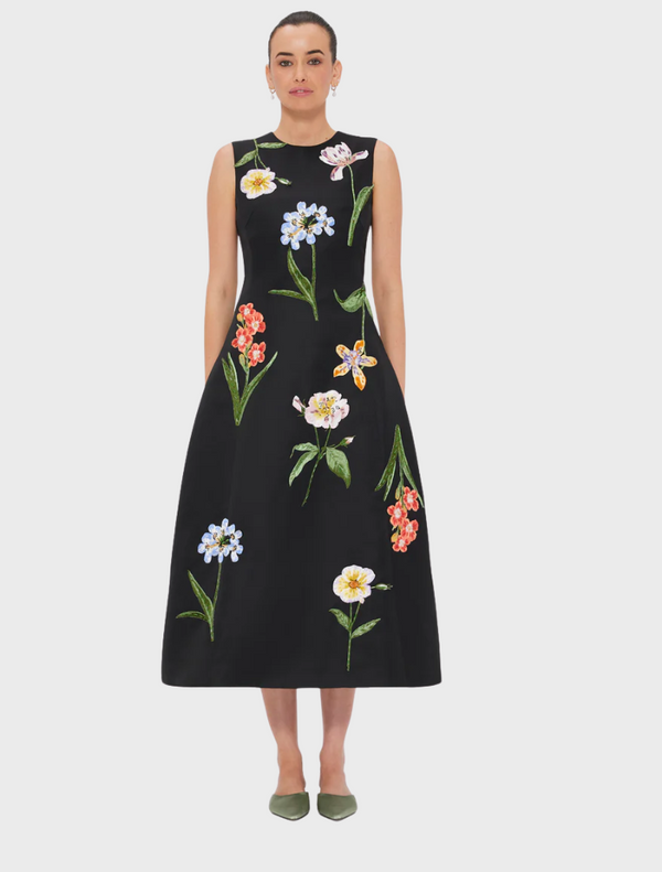 A black sleeveless dress adorned with colorful floral embroidery, featuring a flared skirt and a classic silhouette.