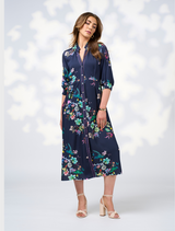 Long sleeve floral print shirt dress featuring a button-down collar, showcasing a vibrant and stylish design.