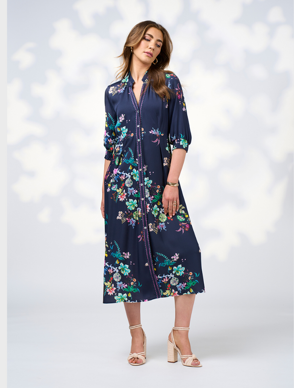 Long sleeve floral print shirt dress featuring a button-down collar, showcasing a vibrant and stylish design.