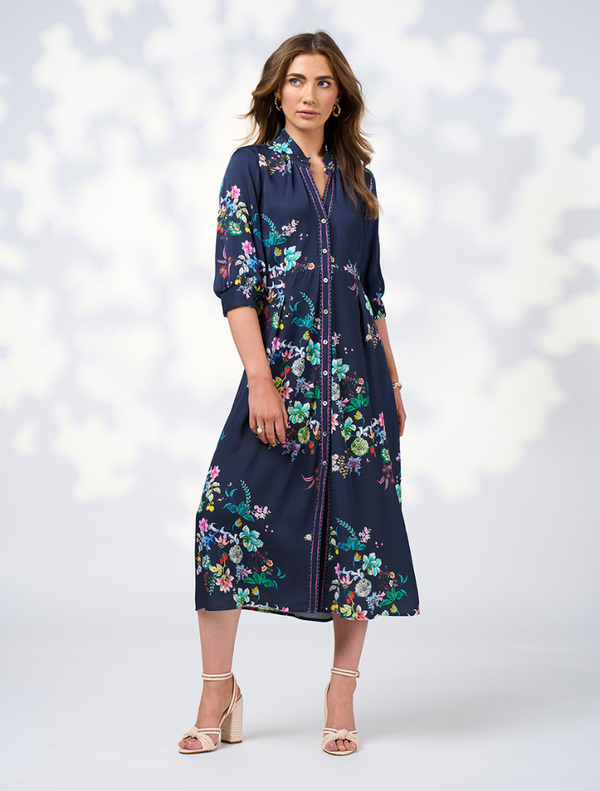 A long sleeve shirt dress with a floral print and button-down collar, perfect for casual or semi-formal occasions.