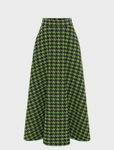 woman in a green and black houndstooth maxi Skirt