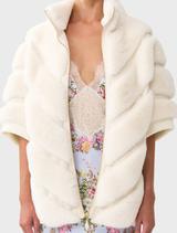 Stylish short sleeve slouch jacket made of faux fur, designed with a distinctive tiled pattern for a chic appearance.