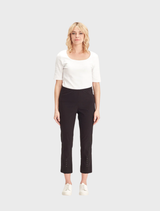 A pair of black 7/8 pants featuring eyelet details, designed for comfort and style, presented against a neutral backdrop.