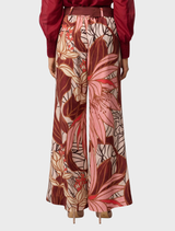 Adele Linen Viscose belted pants featuring a Cathedral Botanic print in vibrant colors.