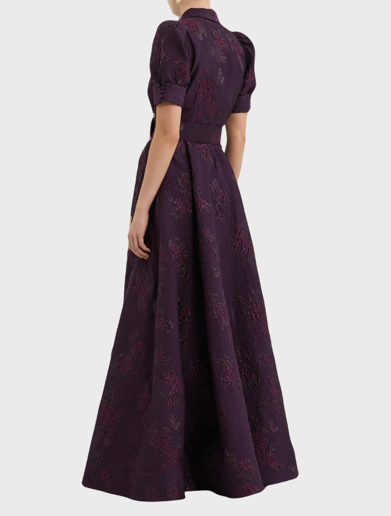 Afina short sleeve gown in blackberry color, featuring a flowing design and elegant silhouette for formal occasions.