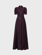 Afina short sleeve gown in blackberry color, featuring a flowing design and elegant silhouette suitable for formal occasions.
