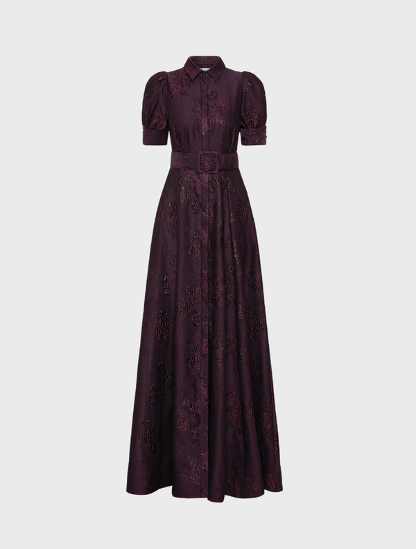 Afina short sleeve gown in blackberry color, featuring a flowing design and elegant silhouette suitable for formal occasions.
