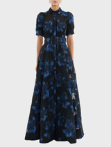 Short-sleeved black and blue floral dress, known as the Alexandra Gown in Navy.