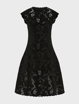 Elegant black Alexandria dress hanging on a rack, showcasing its sleek lines and sophisticated style.