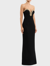 Stunning black Alexandrite gown, characterized by its elegant lines and luxurious fabric, ideal for evening events.