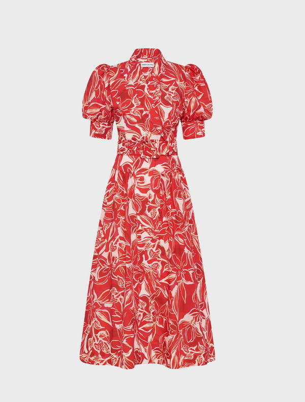 A red dress featuring a vibrant white and red floral print throughout the fabric.