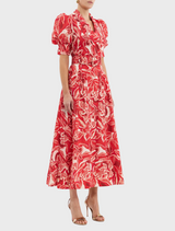 A bright red dress showcasing a charming floral design in white and red.
