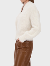 Cozy almond plush cardigan jacket featuring an open front and long sleeves, ideal for casual or comfortable wear.