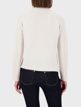 Classic almond Monari rib sweater, showcasing a simple yet elegant design suitable for various occasions.