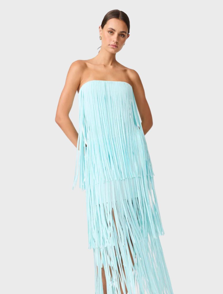 Elegant strapless dress in light blue, featuring fringes that add a playful touch to the design.
