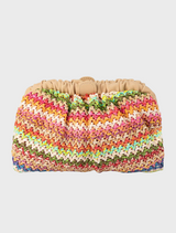 A multicolored knitted clutch bag, the Amalia Petite Gathered Clutch, showcasing vibrant hues and a stylish design.