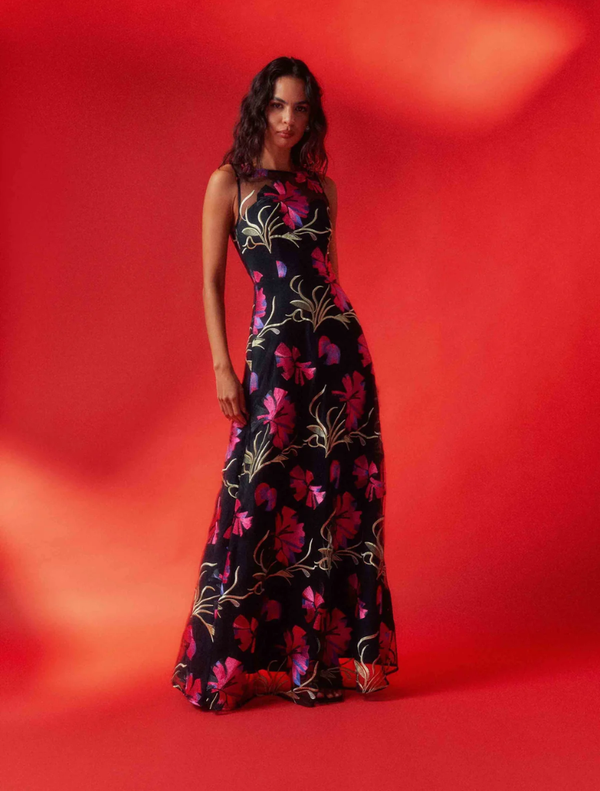 Black gown featuring vibrant pink floral designs, perfect for formal occasions and adding a touch of elegance.