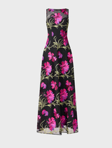 Black gown with delicate pink floral accents, offering a chic and graceful look for evening wear.