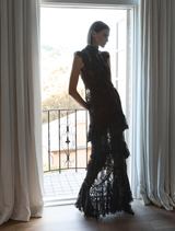Antoinette's black sleeveless top, designed for versatility and elegance in any wardrobe.