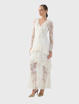 Romantic cream dress with scalloped lace and frill accents, flowing into a full-length skirt suitable for day-to-evening wear.