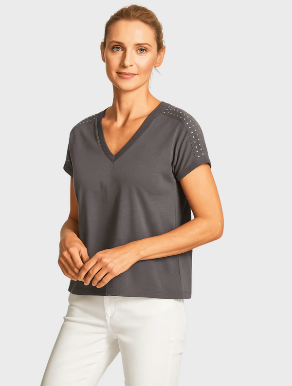 A chic women's grey top with embellished studded sleeves, ideal for a fashionable and modern look.