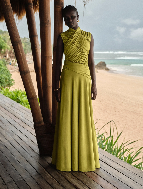 Juniper gown in a vibrant apple hue, showcasing a graceful design with soft draping and refined details.