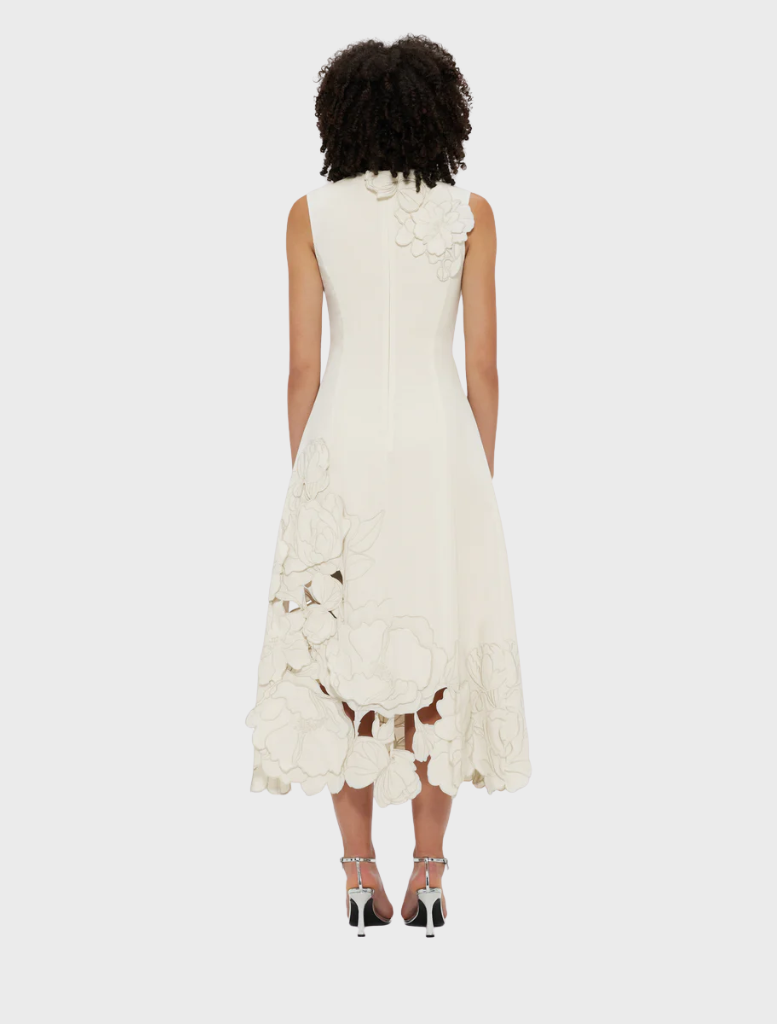 Stylish sleeveless midi dress in vanilla, showcasing delicate appliqué accents for a chic summer look.