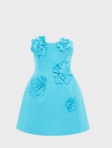 A floral-patterned dress featuring vibrant flowers on a light background, perfect for spring or summer occasions.