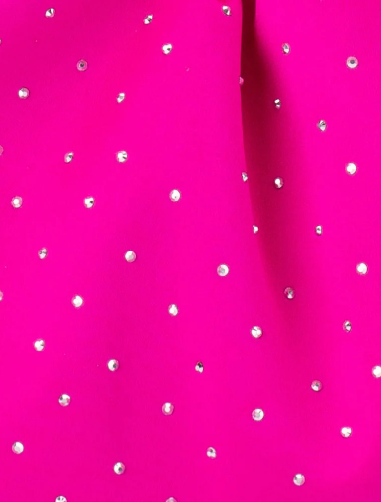 Fuchsia clutch bag with a chain strap, known as the Archie Top Handle Pouch, perfect for a fashionable accessory.