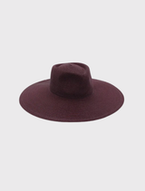 Wide-brimmed burgundy fedora by Morgan & Taylor, designed for a chic look, with an internal cord for adjustable sizing.