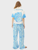 Elegant indigo linen cropped shirt with white botanical prints, classic collar, and a relaxed silhouette for casual wear.