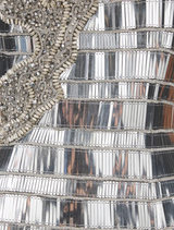 Shimmering silver Ariel dress with a flattering silhouette and thin straps, ideal for special events and formal gatherings.