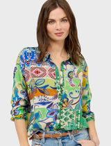 The Audrey Tunic showcases an Armeria Patchwork pattern, blending vibrant colors and textures for a unique fashion statement.