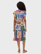 A fashionable tea-length dress with tiers, accented by a vibrant Armeria scarf, ideal for enhancing any outfit.