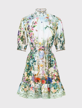 Mini length dress with shirred waist and blouson sleeves, showcasing a floral design inspired by Schonbrunn Palace's decor.