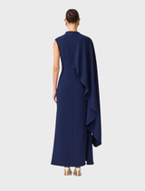 Deep navy Leonara dress with an asymmetric cape design, combining elegance and contemporary fashion for formal wear.