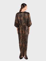 Elegant maxi dress with kimono sleeves, showcasing a bold atomic pattern in bright colors for a stylish look.