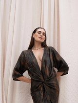 Flowing maxi dress with kimono sleeves, adorned with a striking atomic design in vivid hues.

