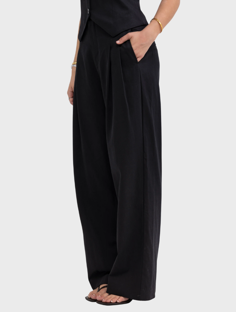 A black jumpsuit made from soft, stretchy fabric, showcasing a sleek and comfortable design.