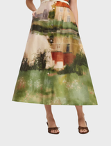 Aubrey's midi dress in a serene print, characterized by its flowing design and sophisticated style.
