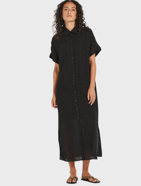 Black linen shirt dress displayed on a hanger, showcasing its lightweight fabric and elegant design.