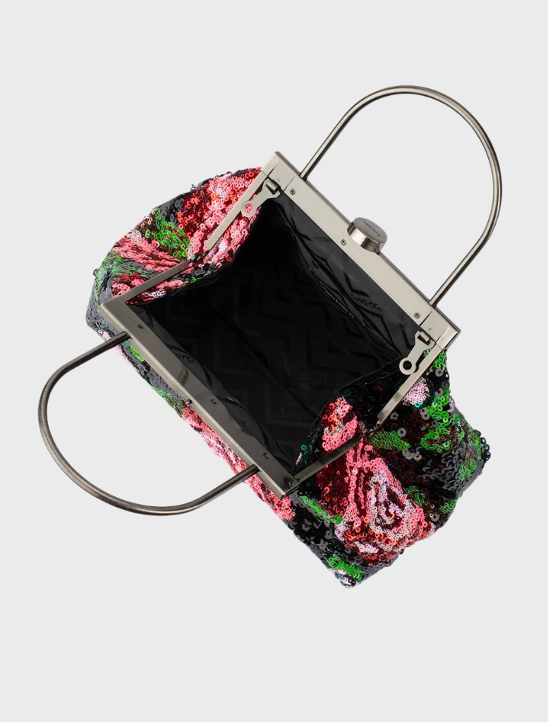 A floral bag in black and pink with a sleek metal handle, ideal for adding a touch of elegance to any outfit.