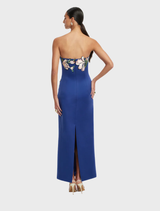 Stunning midnight blue maxi dress with a floral appliqué bustier, designed for a chic and sophisticated look.