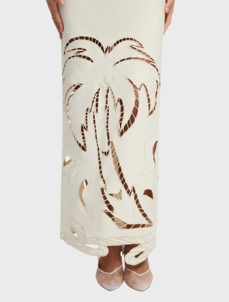 Sophisticated vanilla maxi dress featuring a unique appliqué bustier, perfect for enhancing your summer wardrobe.