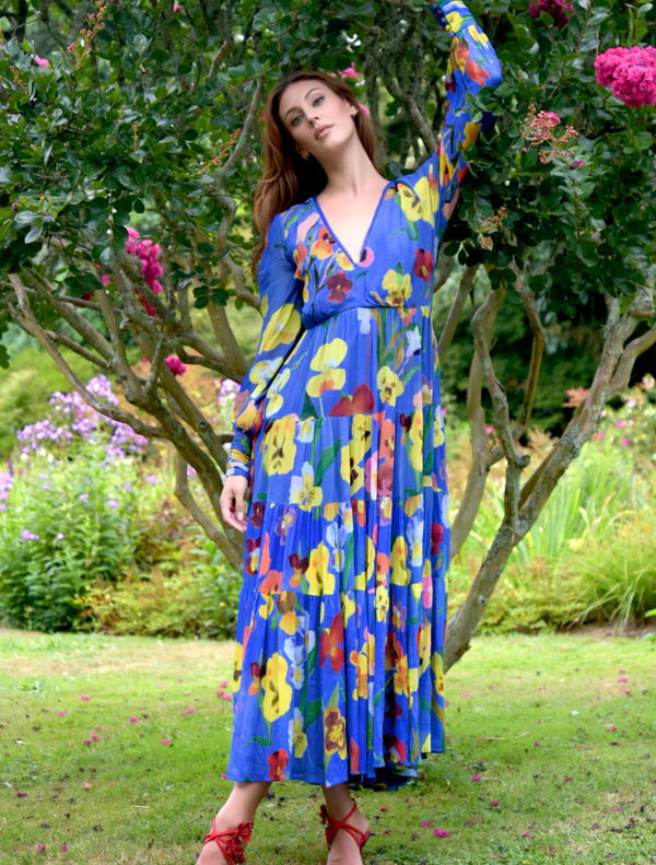 Floral print dress featuring blue trim, designed for a vintage-inspired style, ideal for casual outings.
