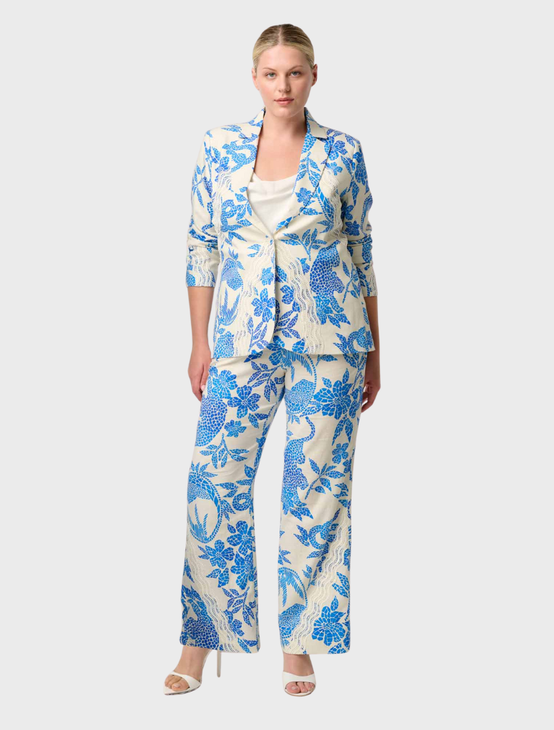 A model displays a blue and white floral suit, highlighting the Leandro Contrast Lace Linen Viscose Stretch Blazer design.